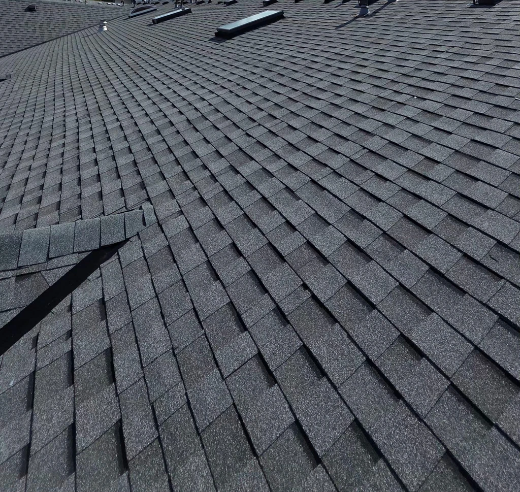 Completed shingle roof planes and valley details